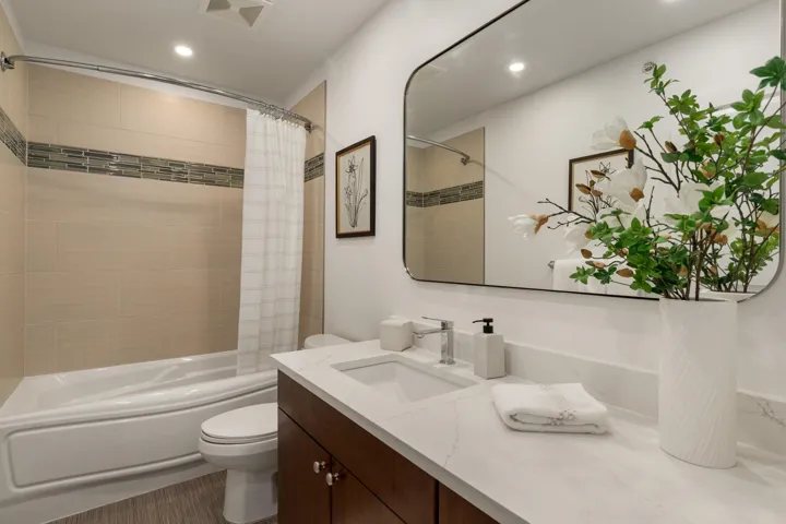 Full bathroom with shower / bath combo, vanity, and recessed lighting