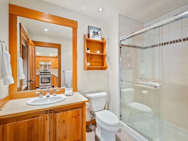 Full bath with vanity, a stall shower, and recessed lighting