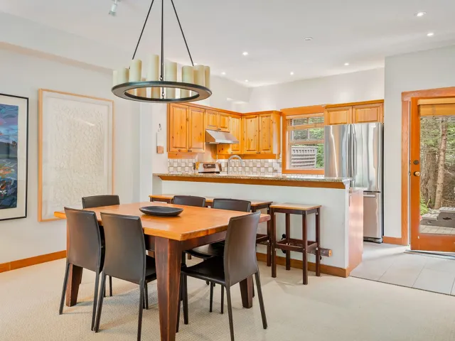 Dining area featuring light carpet and recessed lighting