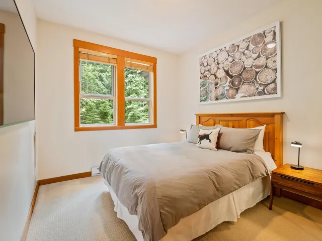 Carpeted bedroom featuring baseboards
