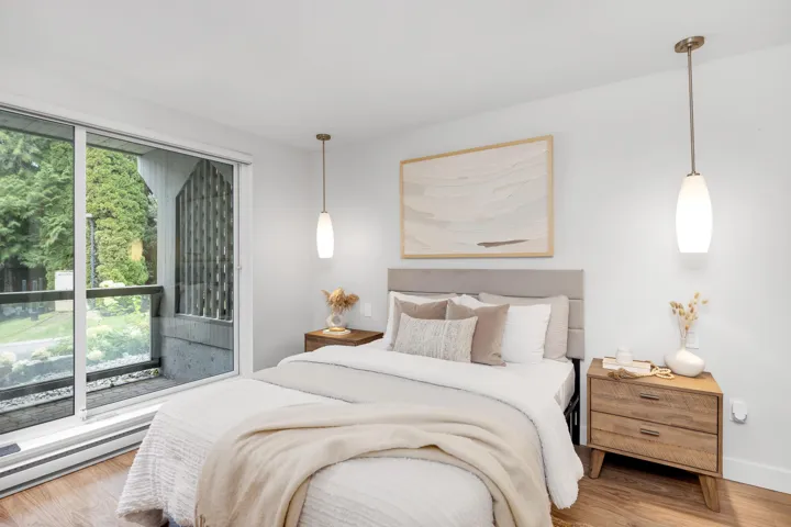 Bedroom featuring wood finished floors and baseboard heating
