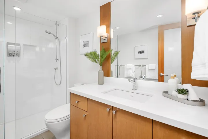 Bathroom with vanity, a stall shower, recessed lighting, and light tile patterned floors