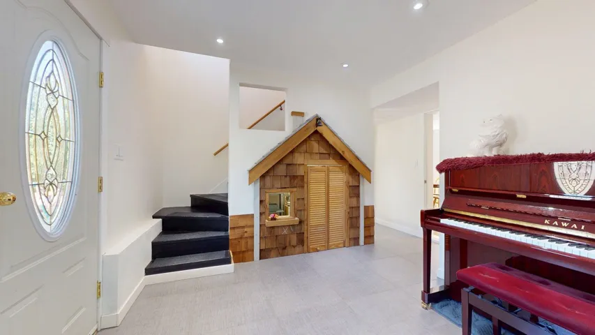 Entrance foyer with stairway, recessed lighting, and tile patterned floors