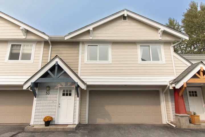View of front of house featuring an attached garage and driveway