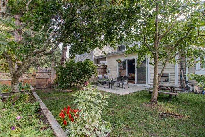 Rear view of house featuring a patio