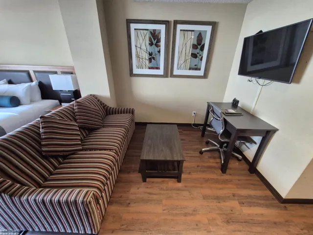 Living area featuring wood finished floors and an office area