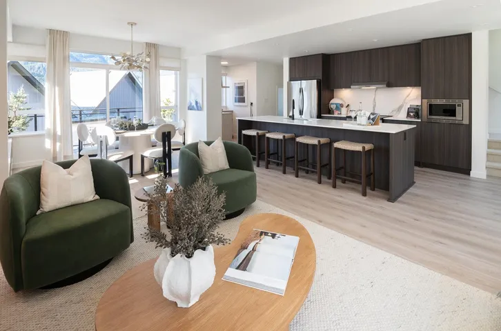 Open-concept living space featuring wood-finish flooring