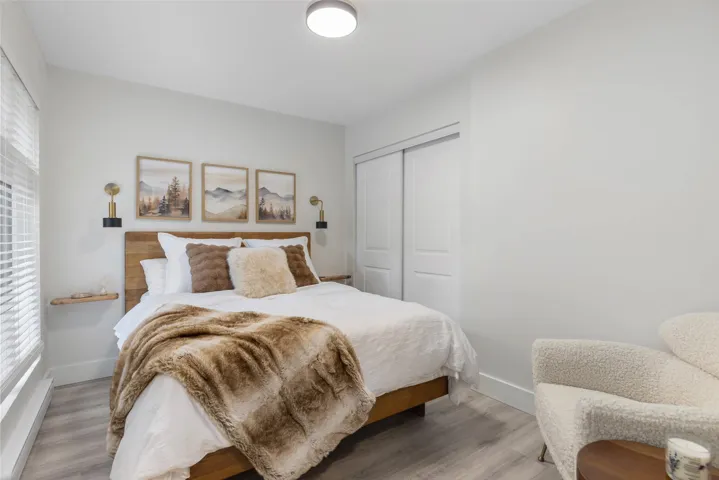 Bedroom with a closet and wood finished floors