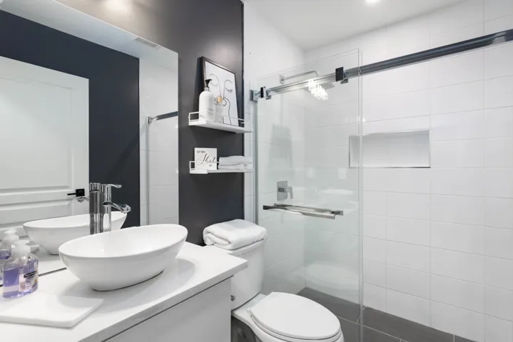 Bathroom with vanity and a shower stall