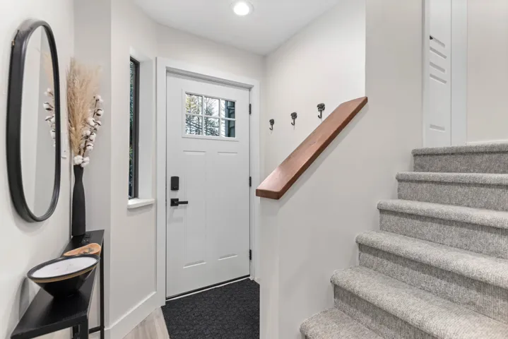Foyer featuring stairs and recessed lighting