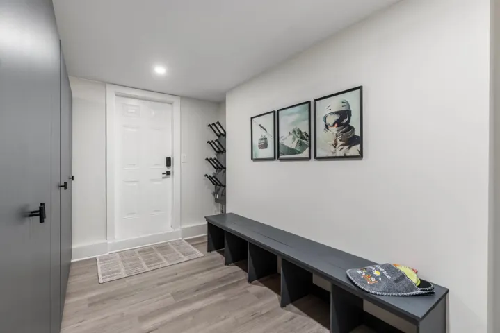 Mudroom with light wood-style floors and recessed lighting
