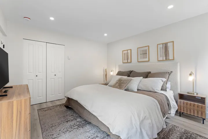 Bedroom featuring recessed lighting, wood finished floors, and a closet