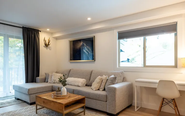 Living area featuring recessed lighting and light-toned walls