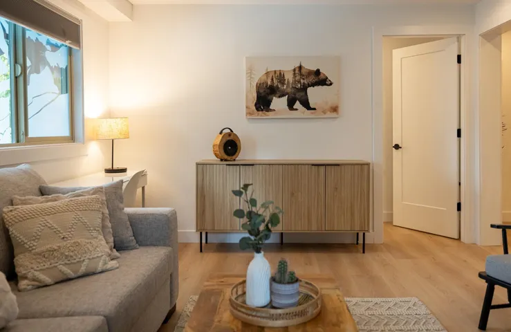 Light wood-finish flooring complements the neutral wall tones