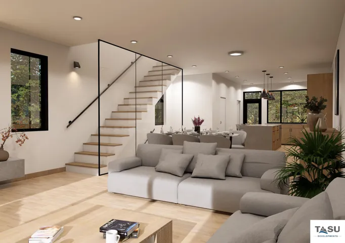 Open-concept living space featuring wood-finish flooring, a contemporary staircase with glass railing, recessed lighting, and large windows with black frames