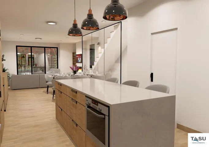 Kitchen island with an integrated oven and light wood-finish cabinetry