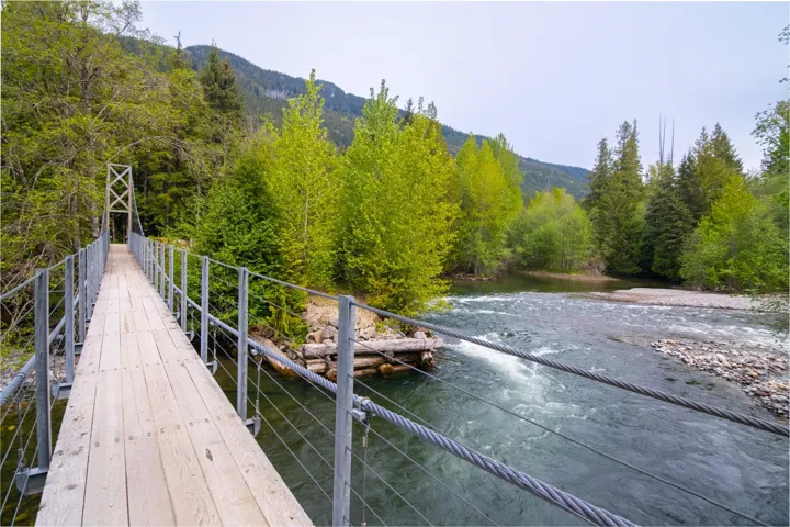 Dock area featuring a view of trees and a mountain view