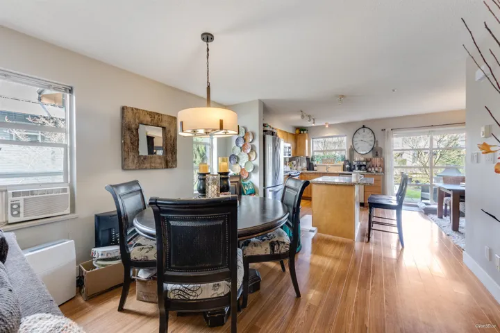 Dining space featuring light wood finished floors and cooling unit
