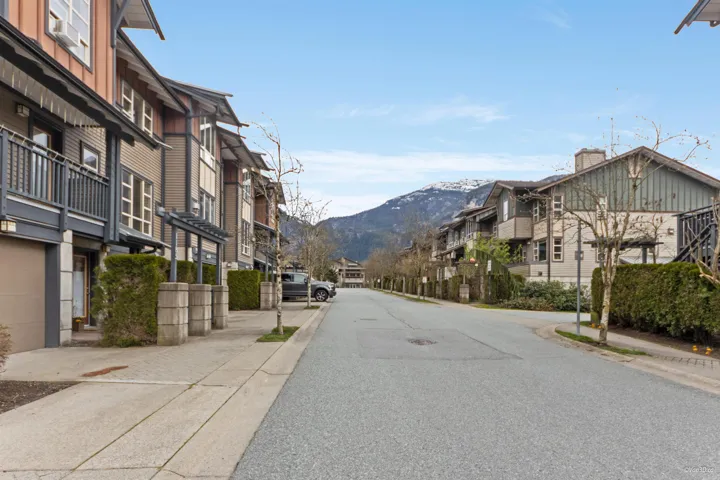 View of street featuring a mountain view, sidewalks, a residential view, and curbs