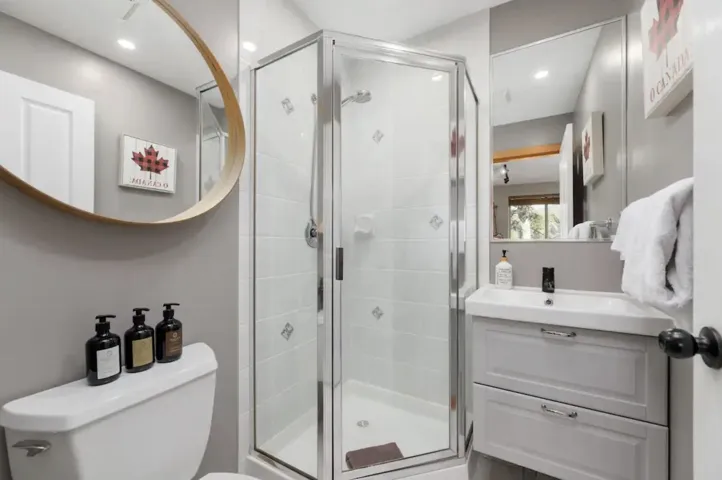 Full bath with vanity, a shower stall, and recessed lighting