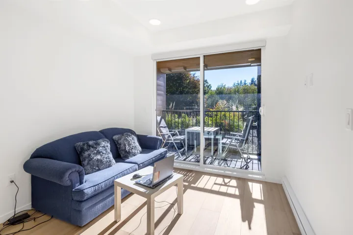 Living room featuring baseboard heating and recessed lighting