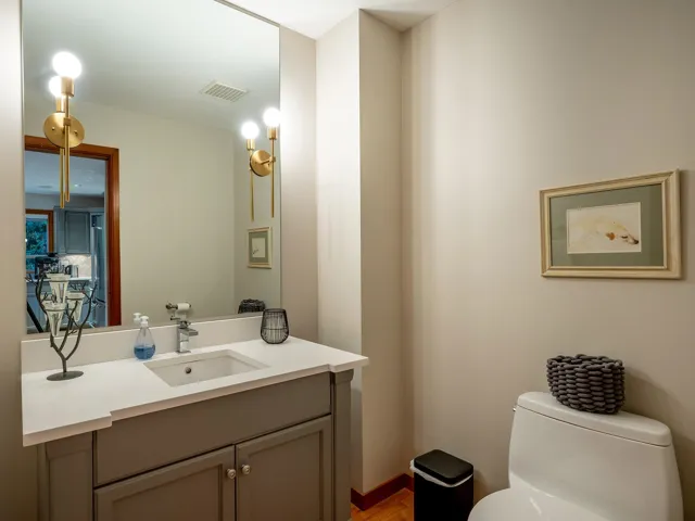 Half bathroom featuring toilet and vanity