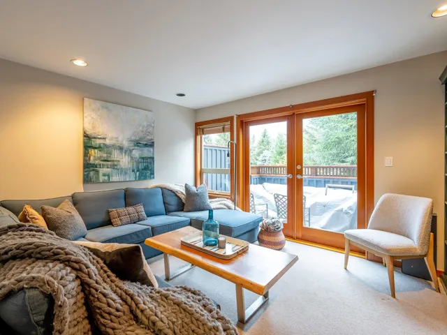 Carpeted living area featuring recessed lighting