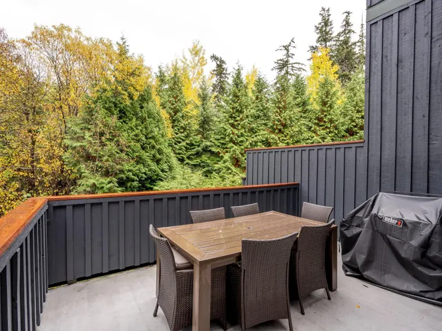 View of patio with area for grilling and outdoor dining space