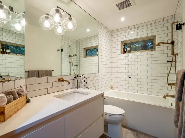 Bathroom featuring shower / bath combination, vanity, dark wood-type flooring, recessed lighting, and backsplash