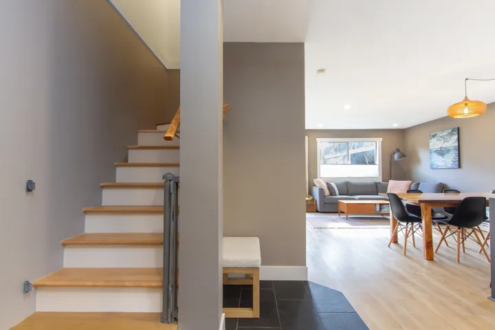 Staircase featuring recessed lighting, baseboards, and wood finished floors