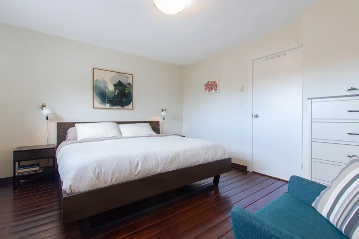 Bedroom featuring dark wood-type flooring
