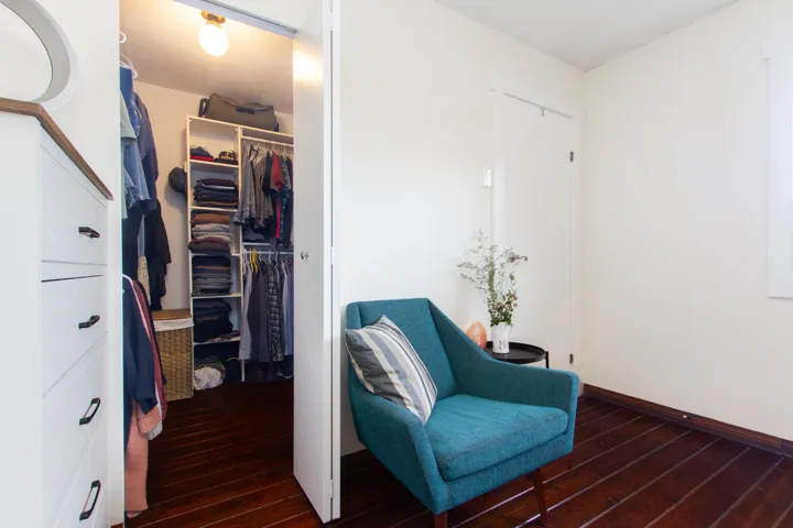 Walk in closet in primary bedroom.