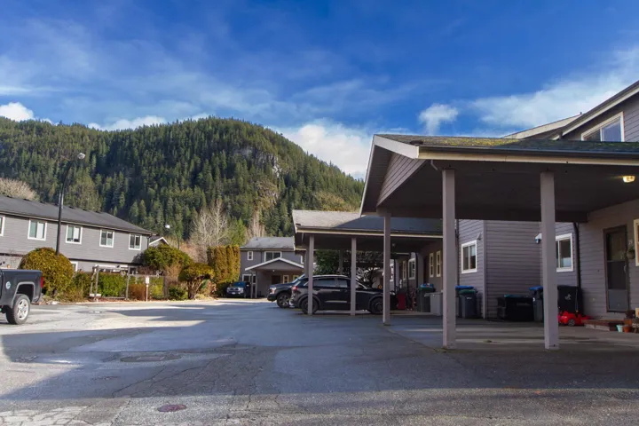 Exterior space with a mountain view and a forest view. 2 designated parking spots by front door.