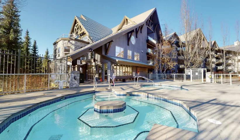 Community pool featuring a hot tub
