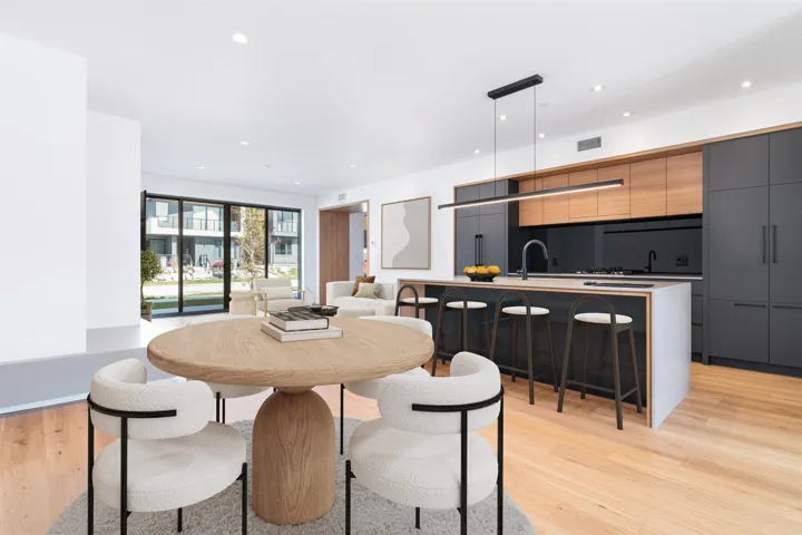 Dining space featuring light wood finished floors, visible vents, and recessed lighting