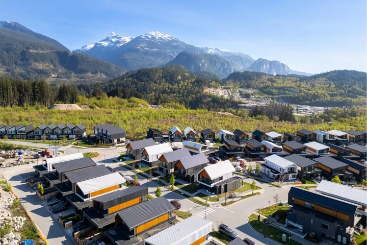 Aerial view with a wooded view, a mountain view, and a residential view