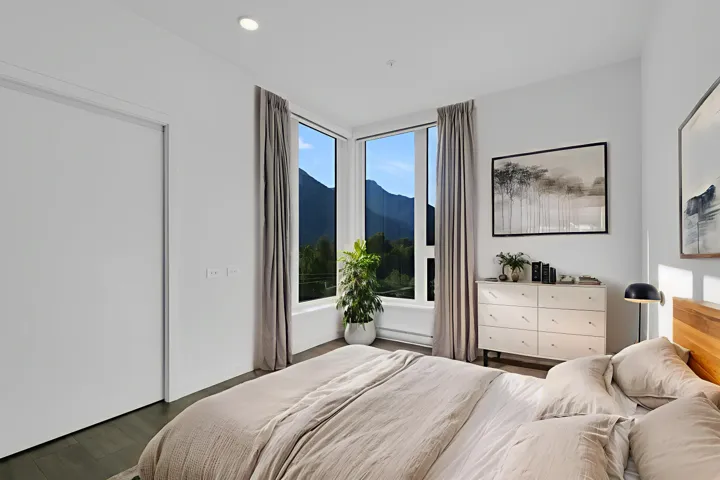 Bedroom with dark wood-type flooring and recessed lighting