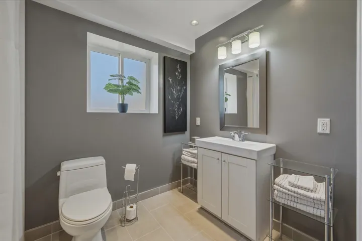 Bathroom with vanity and light tile patterned floors