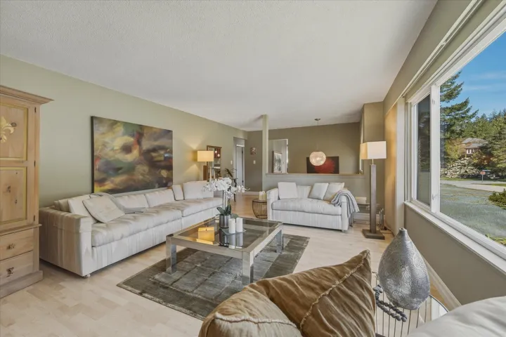 Living room featuring light wood-style floors and baseboards