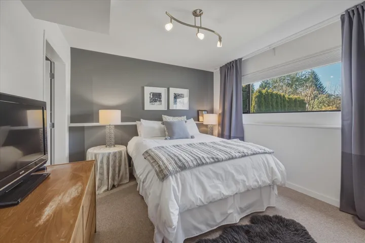 Carpeted bedroom with baseboards