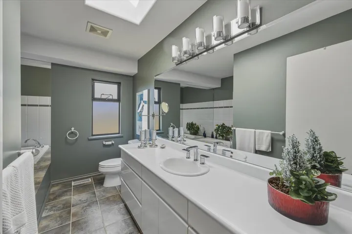 Bathroom with a garden tub and vanity