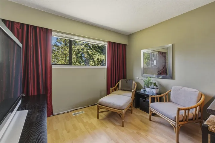 Sitting room featuring light wood-style flooring