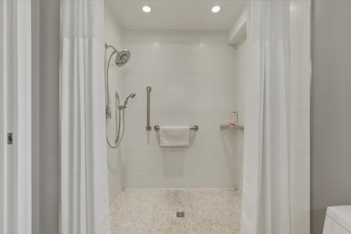 Full bathroom featuring a stall shower and recessed lighting