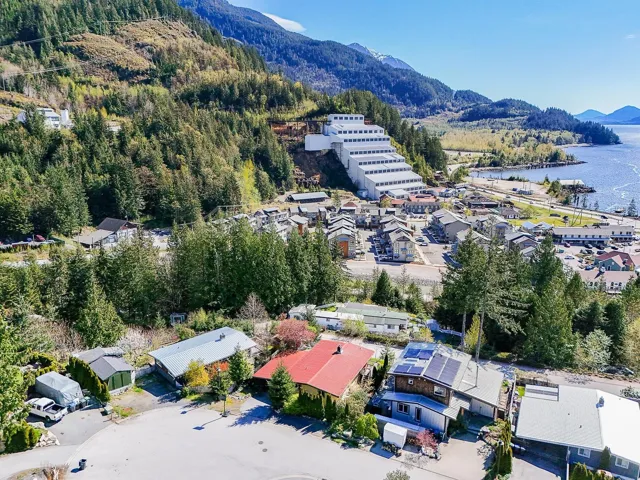 Aerial view with a water and mountain view, a residential view, and a view of trees