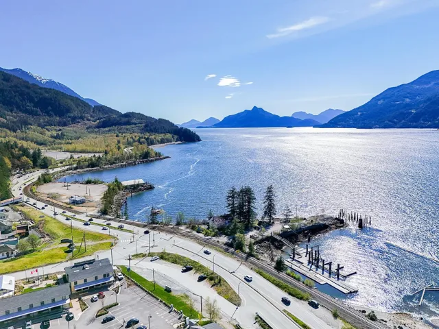 Drone / aerial view with a water and mountain view