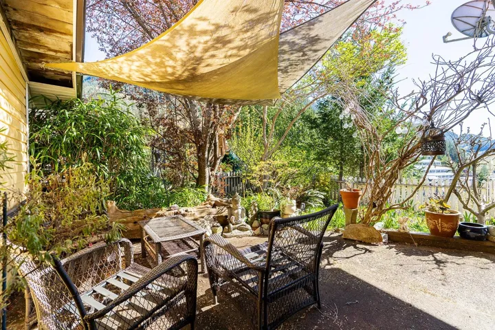 View of patio with fence