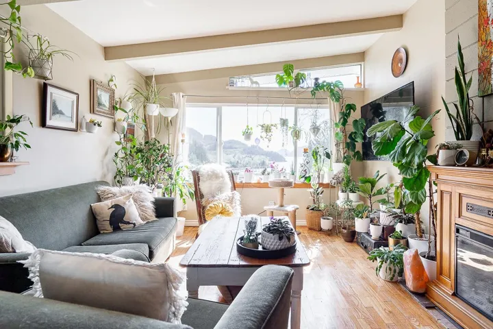 Living area with lofted ceiling with beams and wood finished floors