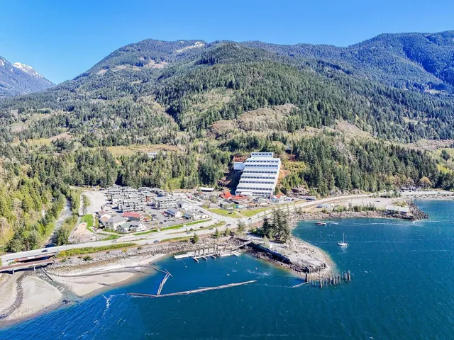 Bird's eye view with a water and mountain view and a forest view