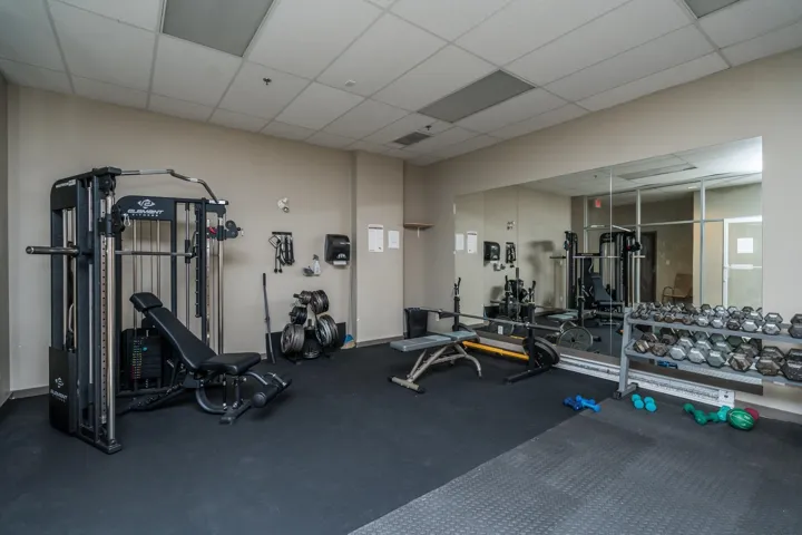 Gym with a paneled ceiling