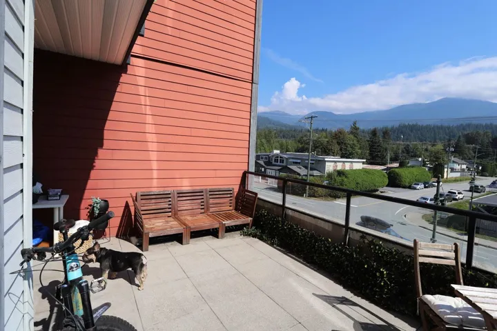 Balcony with a mountain view and a view of trees